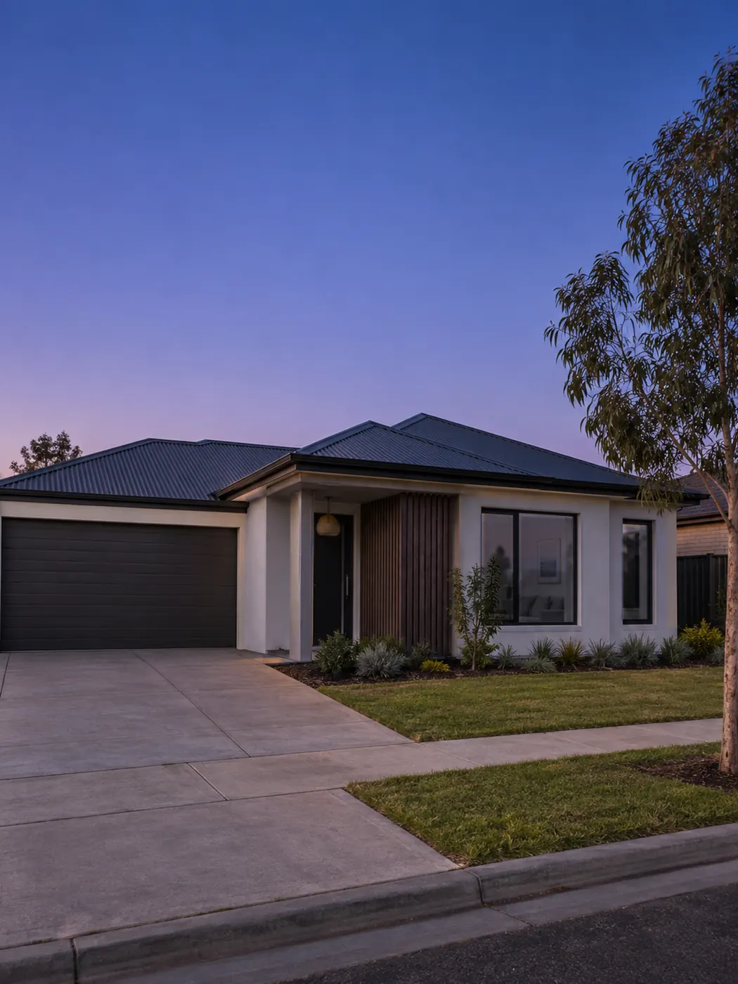 A contemporary family home in the soft light after sunset
